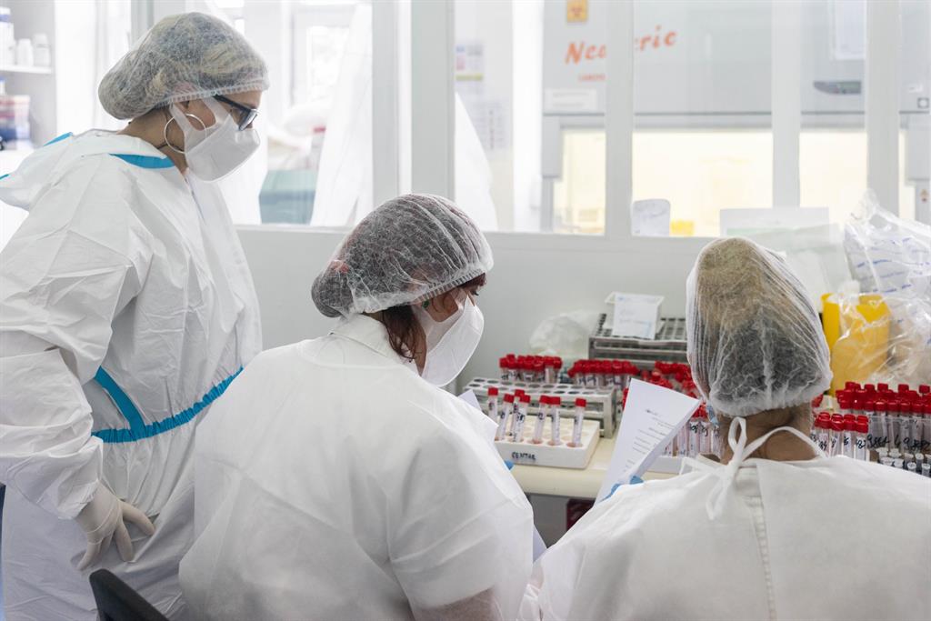 05 Health workers test saliva samples