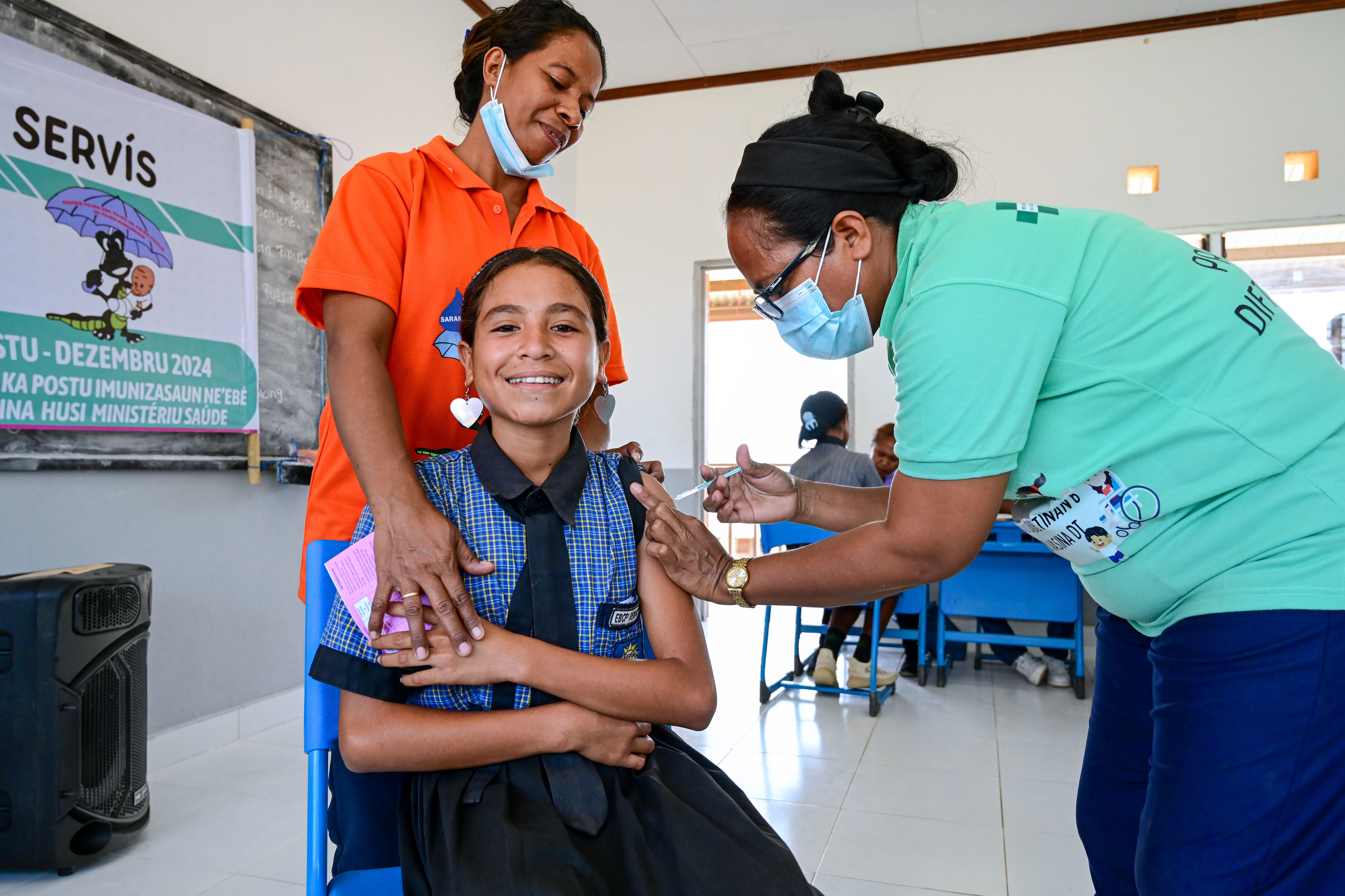 Eldina do Rego gets vaccinated at her school, EBC Remanaru at Laclo in Manatutu.